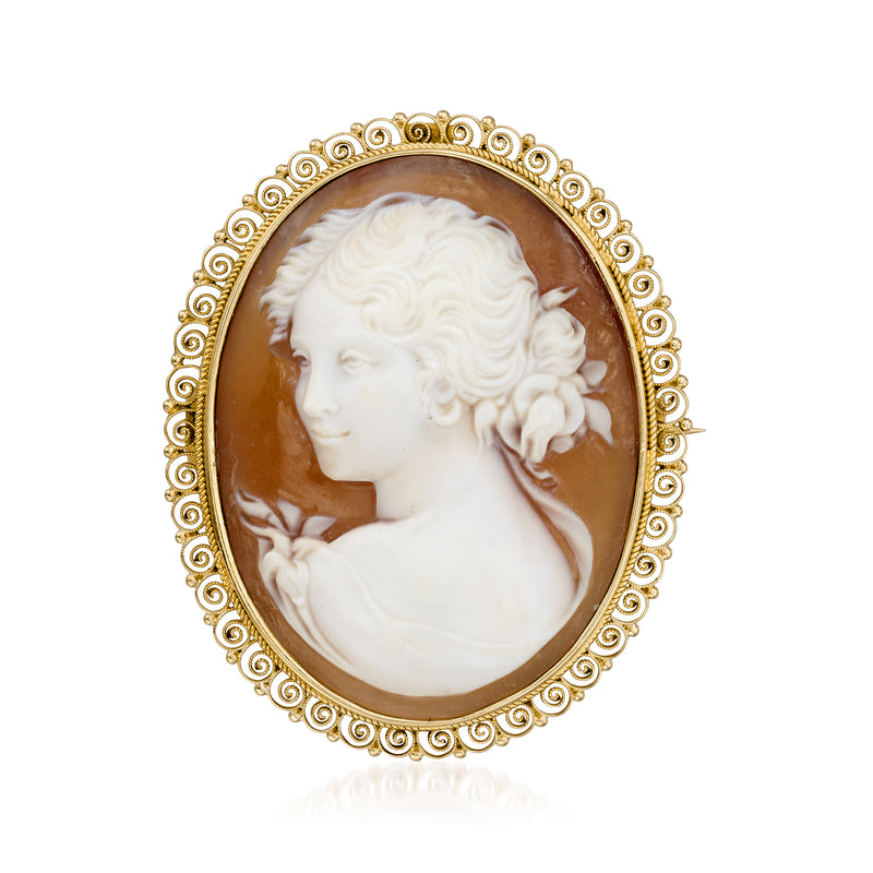 Vintage cameo pin with oval brown shell and white profile portrait, ornate 12kt yellow gold frame
