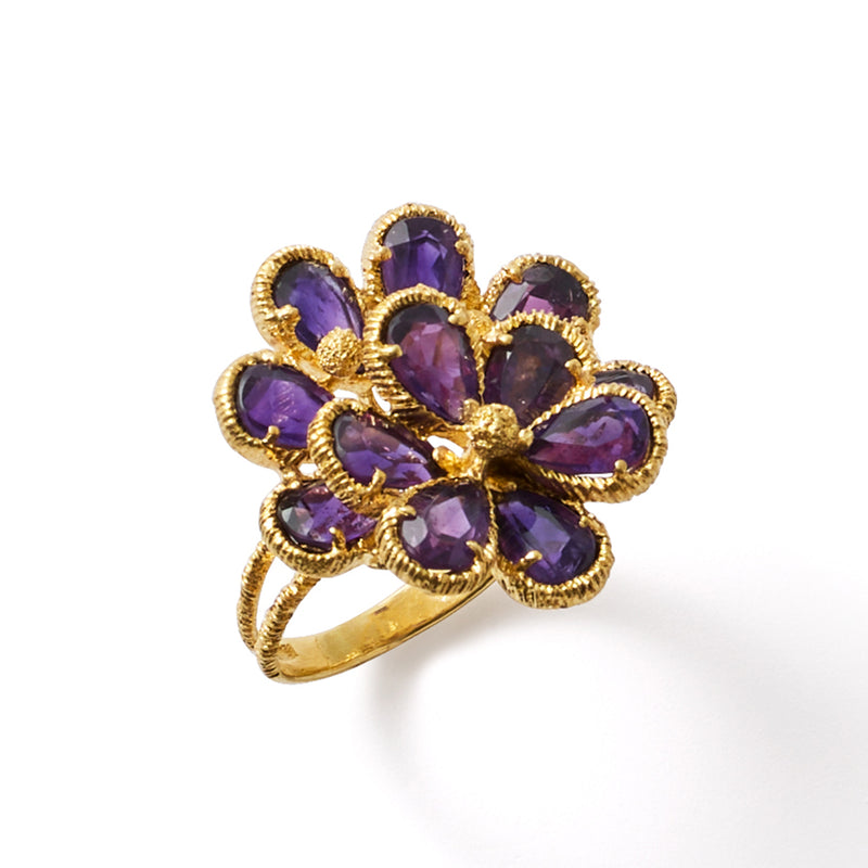 Amethyst flower cocktail ring front view, oval purple gemstones in yellow gold prongs