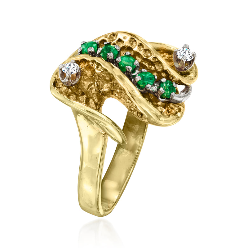 14kt yellow gold swirl ring with emerald and diamond stones, angled side view