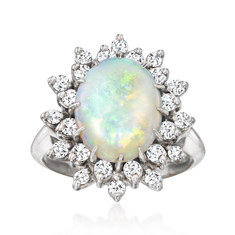 Opal and diamond cluster ring in 14kt white gold, oval opal with prong-set stones