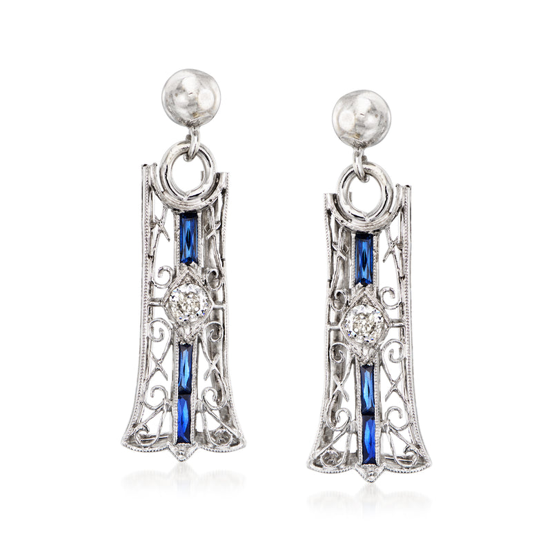 Vintage platinum drop earrings with blue synthetic sapphire accents and diamond details
