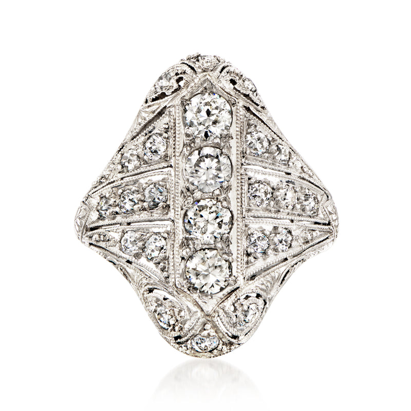 Vintage platinum diamond ring with ornate openwork and multiple round-cut stones