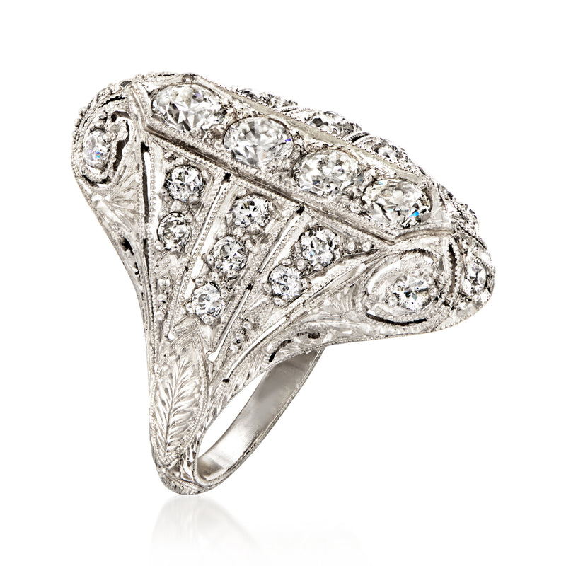 Vintage platinum diamond ring with ornate filigree and marquise top design