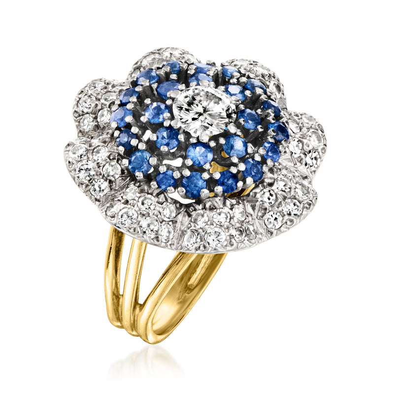 Two-tone gold flower ring with diamond halo and blue sapphire cluster, side view