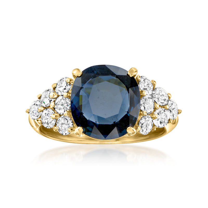 18kt yellow gold ring with oval blue sapphire center and round diamond halo