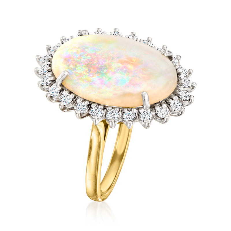 Two-tone gold opal oval cabochon ring with diamond halo