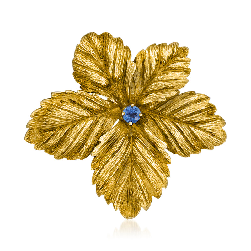Vintage gold flower lapel pin with blue center sapphire
