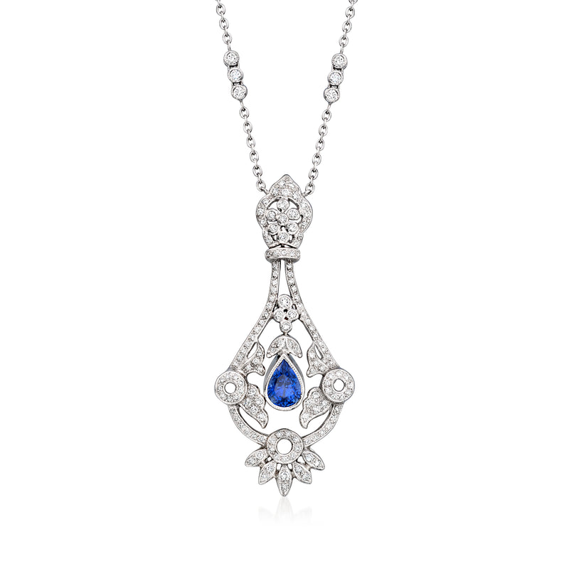 Vintage sapphire and diamond pendant necklace in 18k white gold with pear-shaped blue center