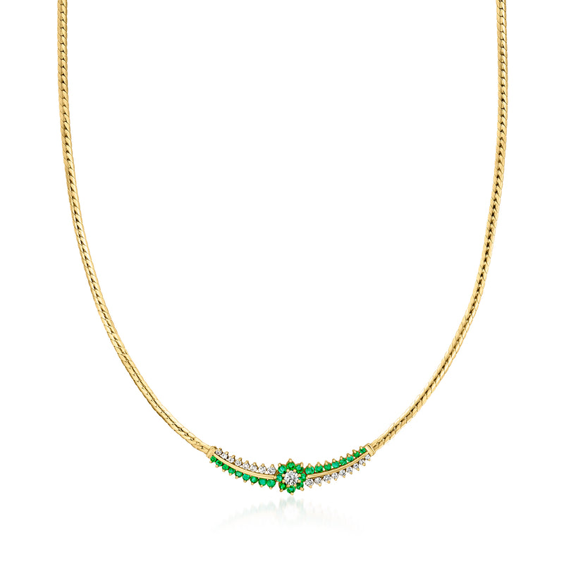 Vintage yellow gold flower necklace with emerald and diamond accents, slender chain