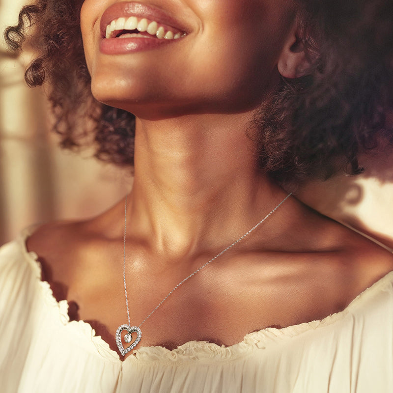 Diamond heart pendant necklace on model, 14kt white gold chain
