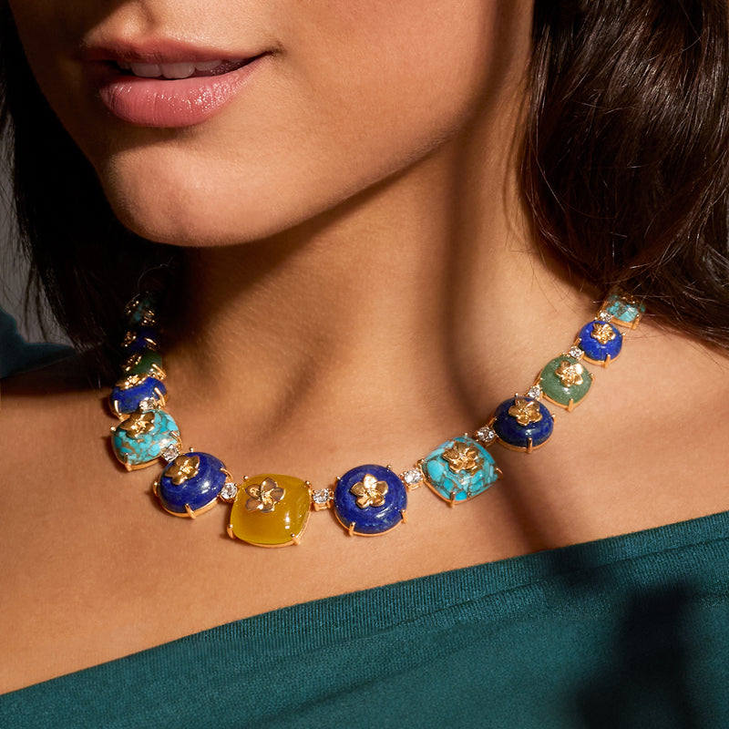 Multi-gemstone necklace on model with blue and turquoise cabochon-style stones