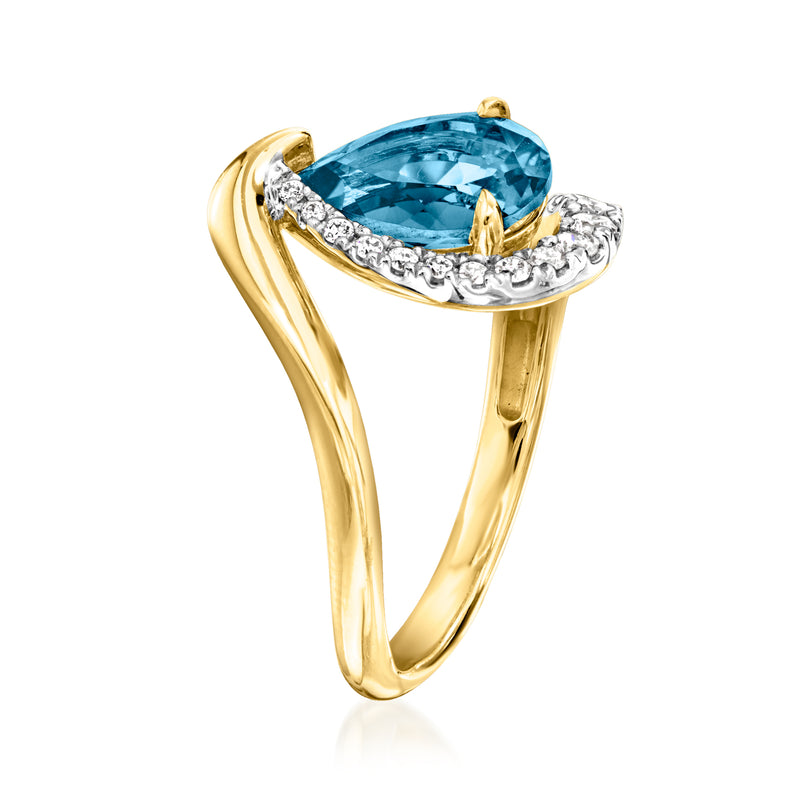 Gold ring featuring a large blue topaz center stone with a white diamond halo