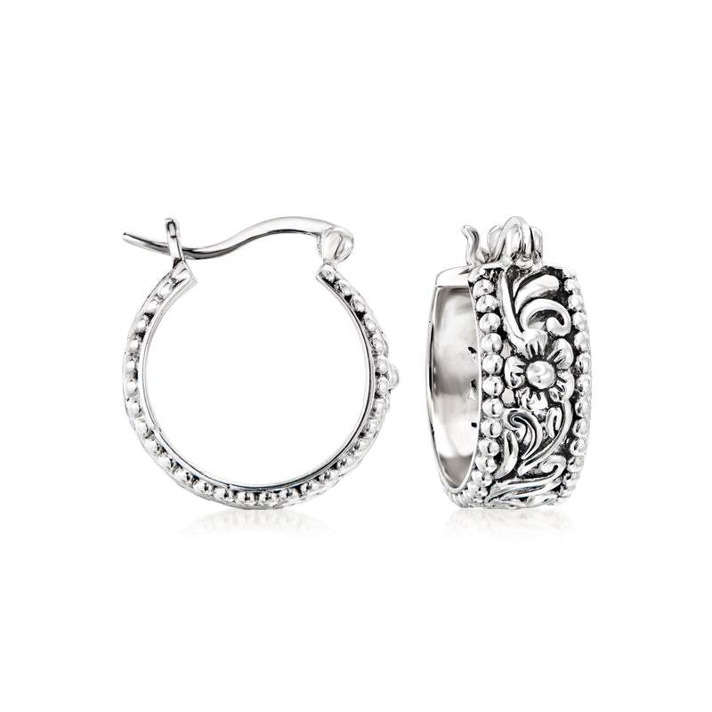 Sterling silver Bali-style floral hoop earrings with carved beadwork texture