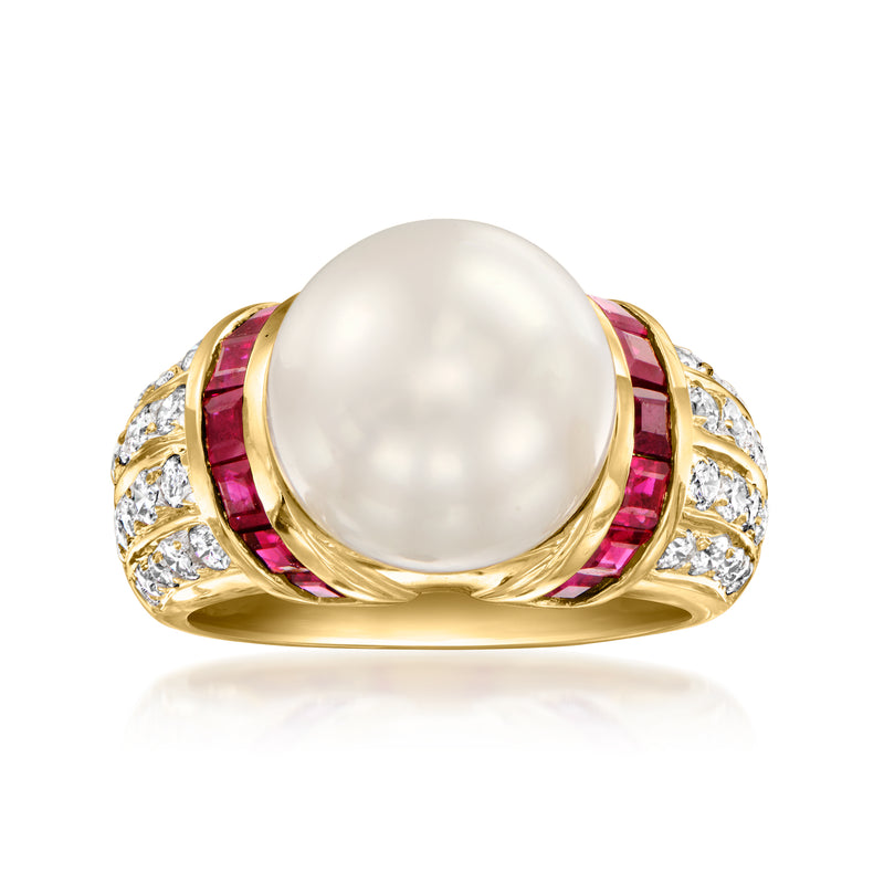 Yellow gold cocktail ring with round white cultured pearl, ruby accents, and diamond details.