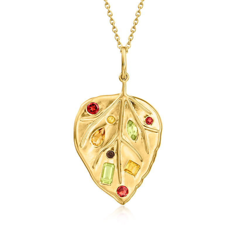 Gold leaf pendant with red, green, and yellow gemstones; gold chain attachment.