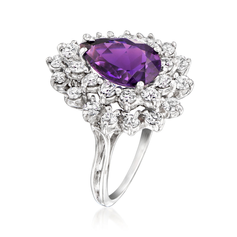 Oval amethyst cocktail ring in 14kt white gold with diamond halo and prongs