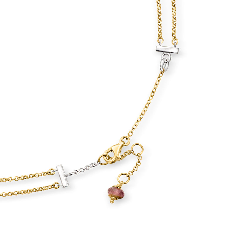 Two-tone gold gemstone necklace with diamond stations and toggle clasp, dangling teardrop