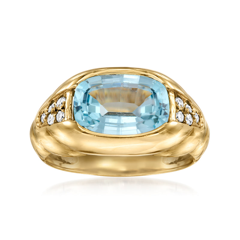 14kt yellow gold ring with oval sky blue topaz and small diamond accents