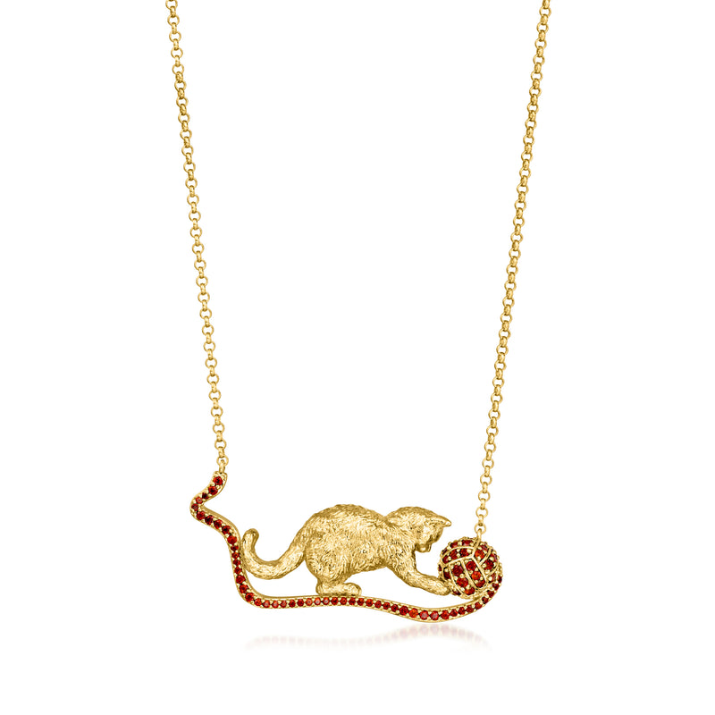 Gold-tone cat necklace with red garnet eyes and yarn ball charm pendant