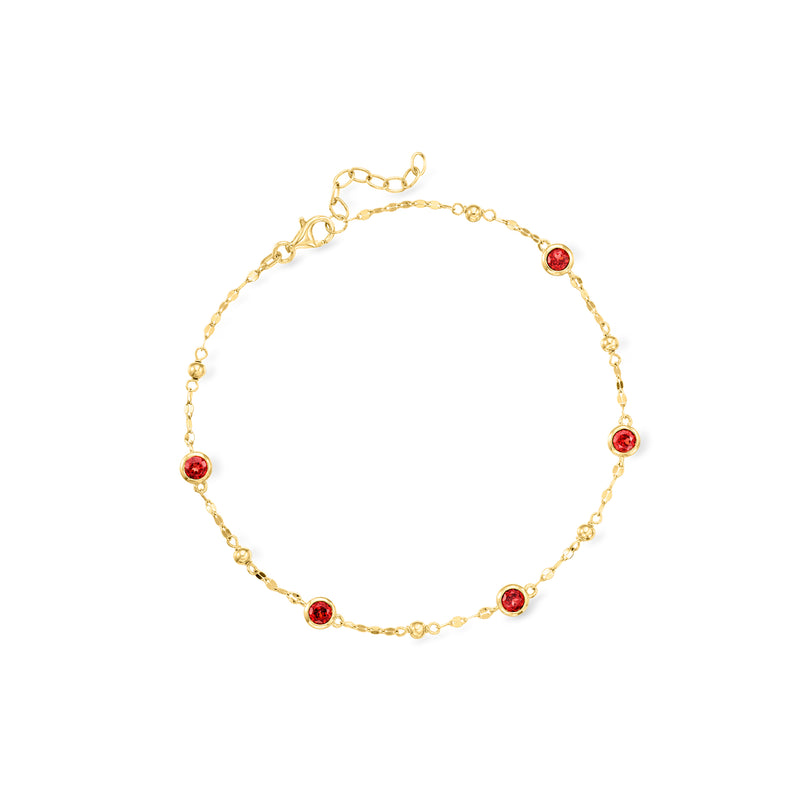 Garnet station anklet in gold over sterling with five round red gemstone stations