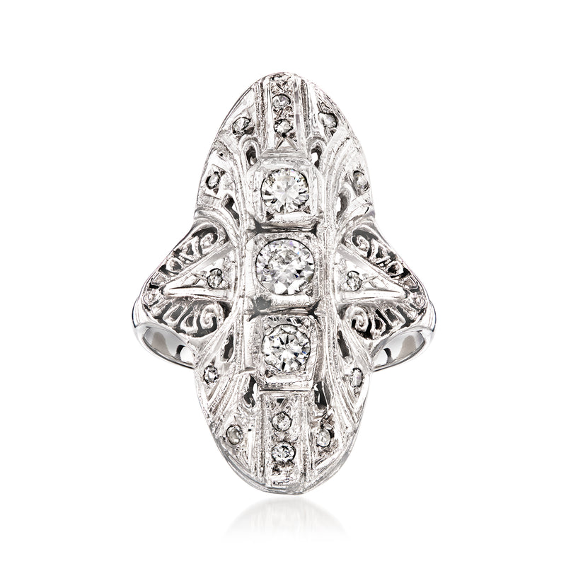 Vintage white gold filigree dinner ring with four round diamonds