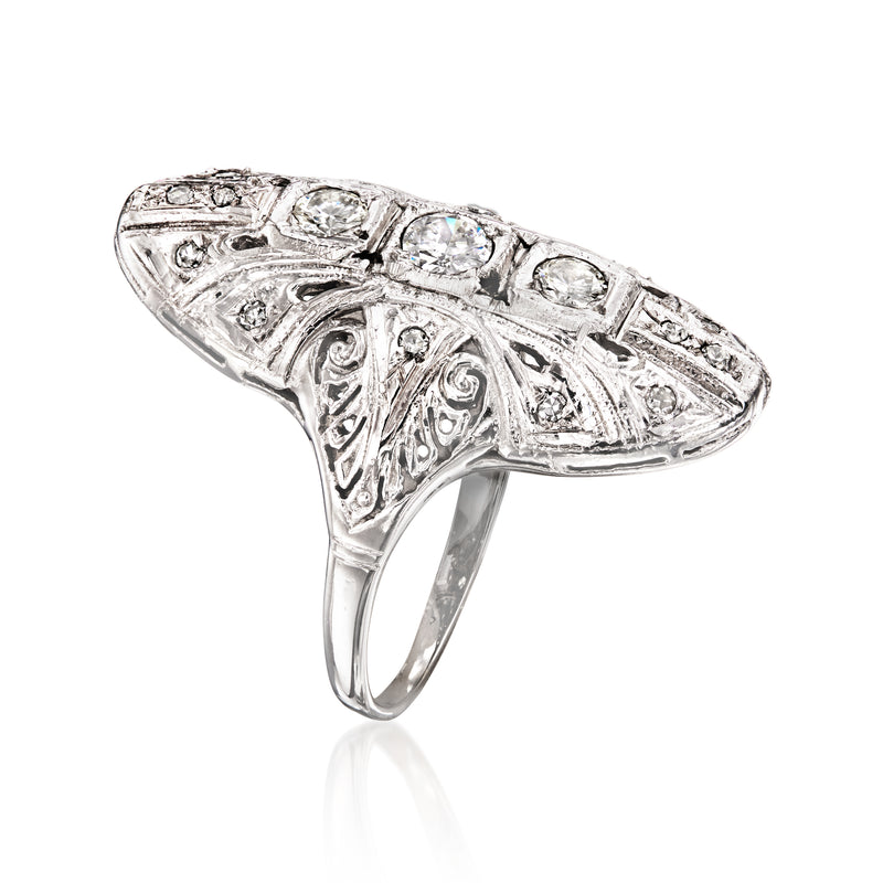 Vintage white gold filigree dinner ring with four round diamonds, side profile
