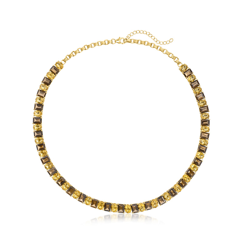Gold-tone tennis necklace with dark and yellow rectangular gemstone links and clasp