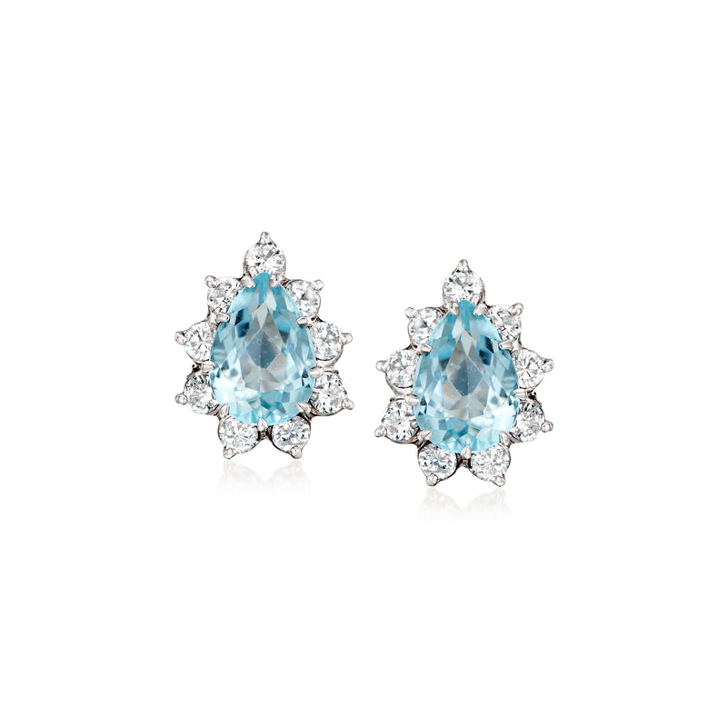 Aquamarine and diamond stud earrings with oval blue center stones, white gold halo