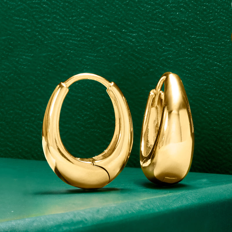 Gold oval hoop earrings with rounded profile and hinged back, shown from side view.