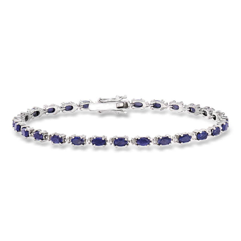 Sterling silver tennis bracelet with blue oval sapphires and diamond accents