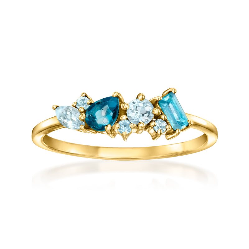 14kt yellow gold ring with three blue topaz stones: oval center with side ovals
