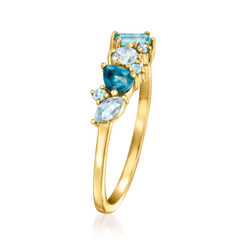14kt yellow gold ring showing side view of three oval blue topaz stones in prongs