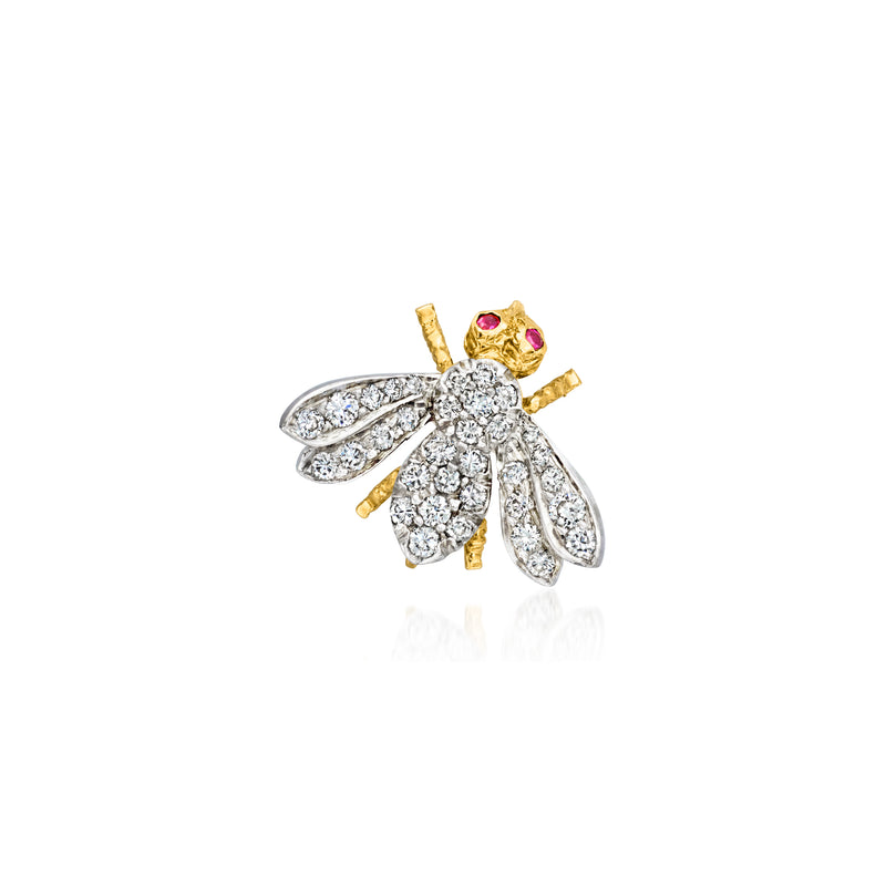 Two-tone gold bumblebee pin with diamond body, ruby eyes, and textured wings