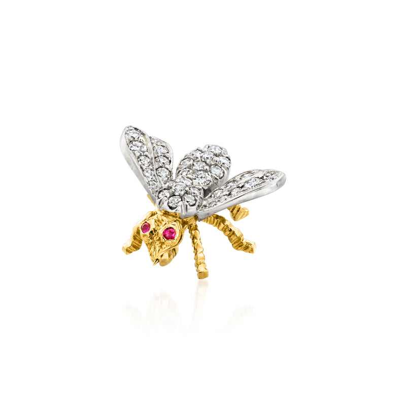 Two-tone gold bumblebee pin with diamond-paved wings, ruby accents, and curved body