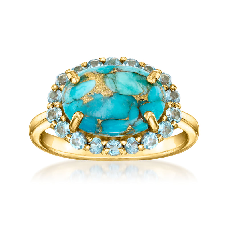 Turquoise oval gemstone halo ring in gold with blue topaz accents