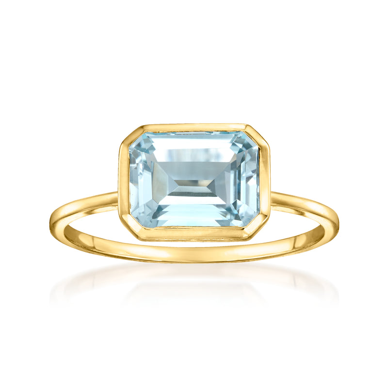 14kt yellow gold ring with sky-blue topaz emerald-cut center stone