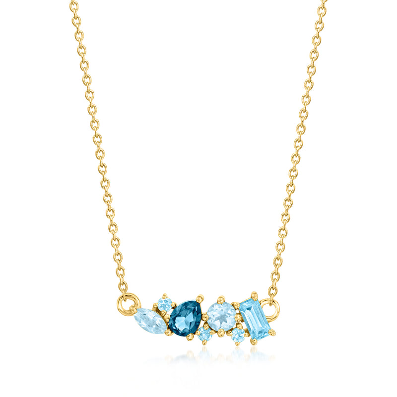 14kt yellow gold necklace with blue topaz oval, round stones, and baguette accents
