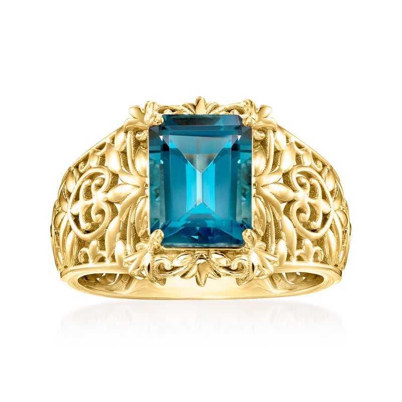 Gold ring with emerald-cut London blue topaz and ornate scrollwork setting