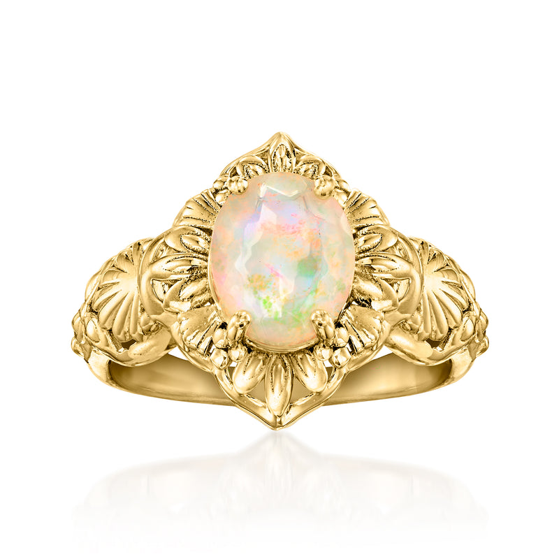 Gold-tone ring with marquise opal centerpiece and ornate filigree band