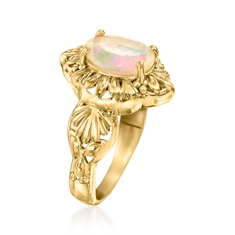 Gold-tone marquise opal ring with raised gemstone and engraved side details
