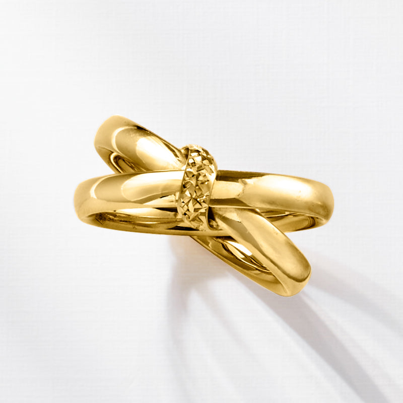 Yellow gold crisscross knot ring angled view with textured center detail