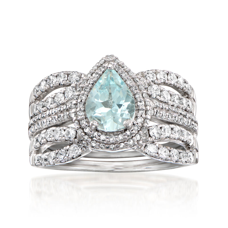 Aquamarine and diamond cluster ring in white gold with oval/pear center stone