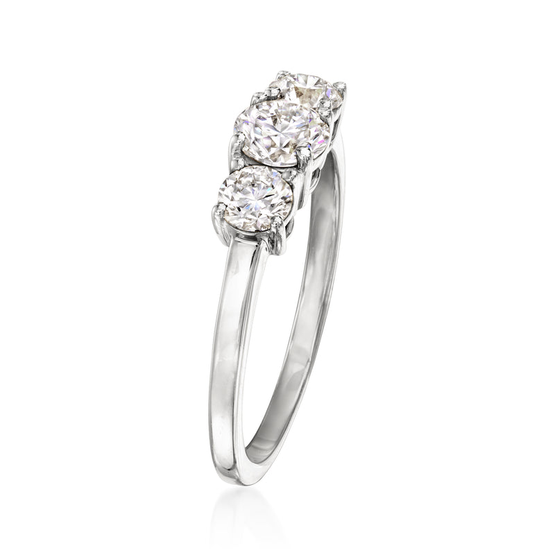 Three-stone diamond ring, side view, 14kt white gold with three round stones.