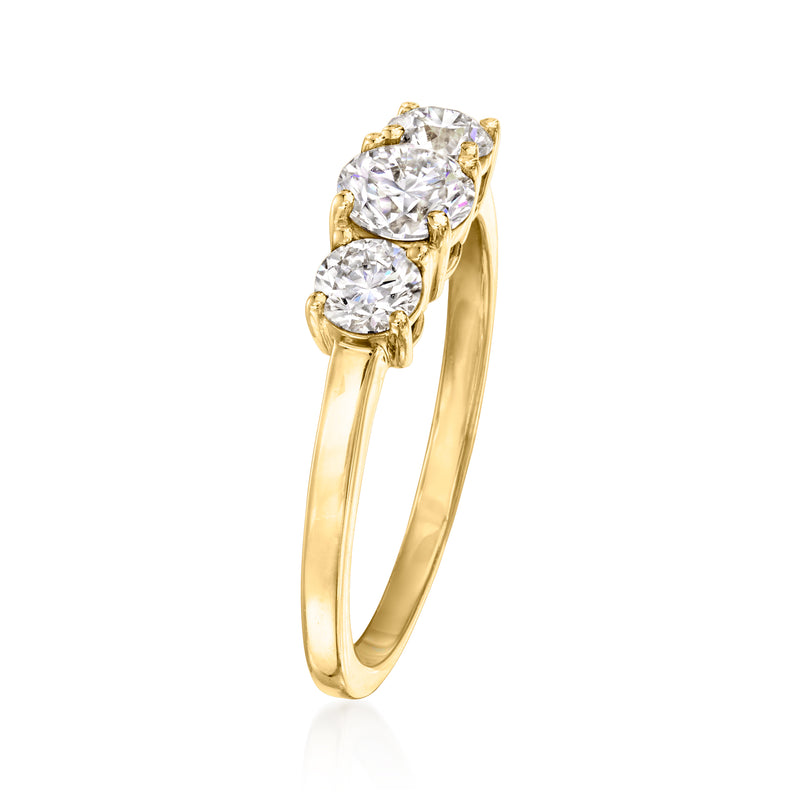 14kt yellow gold three-stone diamond ring, side view with prong-set round stones