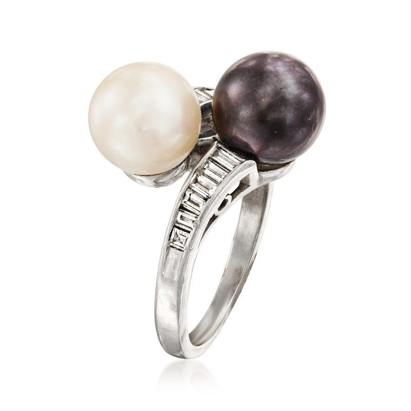 Platinum bypass ring angled view with white and dark pearls and diamond baguette bands