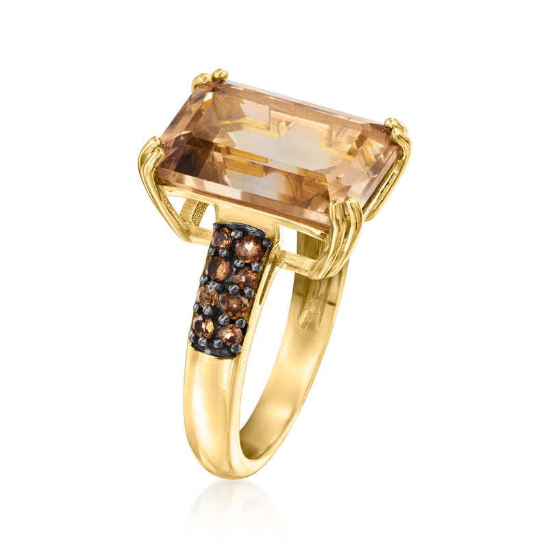 Gold ring featuring a smoky quartz cushion center, prong-set, with black pave band.