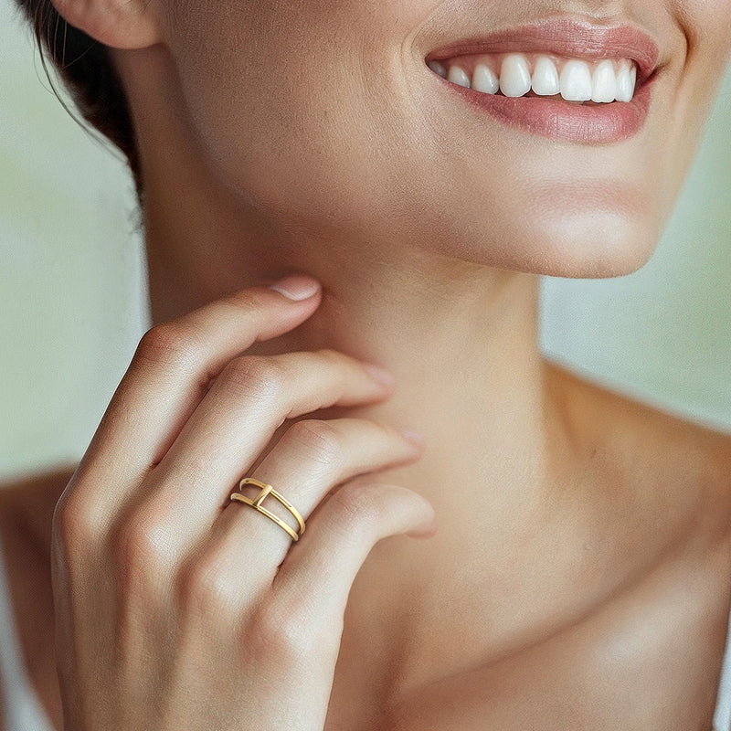 10kt yellow gold open-space bar ring on finger with stacked bands and vertical bar