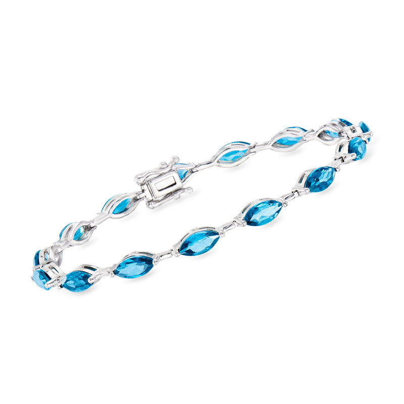 Sterling silver bracelet with oval blue topaz stones in a link design