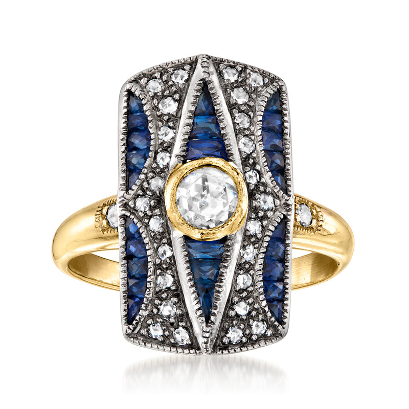 Two-tone gold vintage ring with blue sapphire side stones and round crystal center