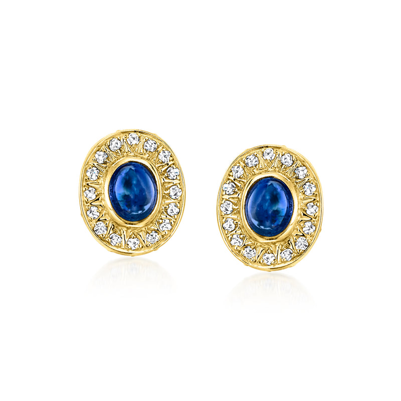 Oval blue sapphire stud earrings with diamond halo in yellow gold, post backs